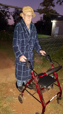 Mr. Allen, an Integratedliving client, posing with his wheelie walker