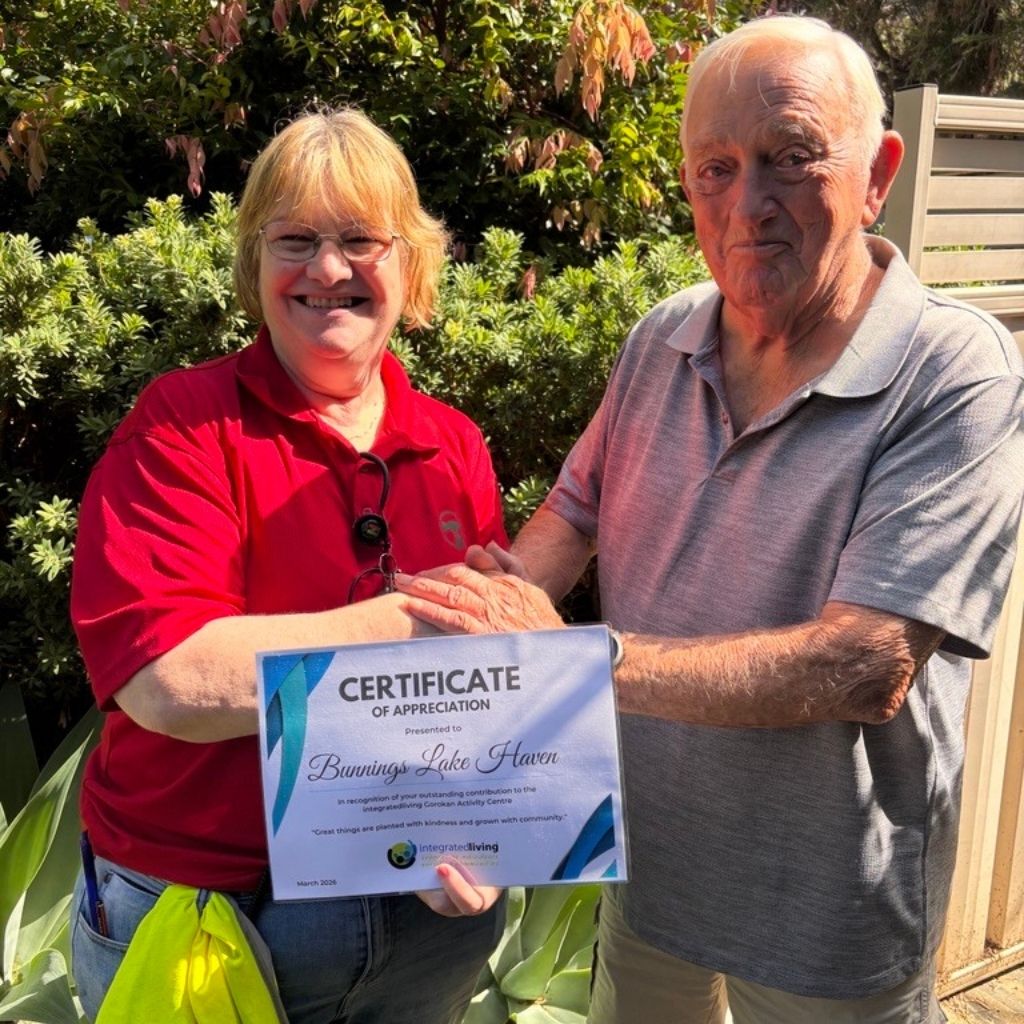 client with Bunnings worker being presented a certificate