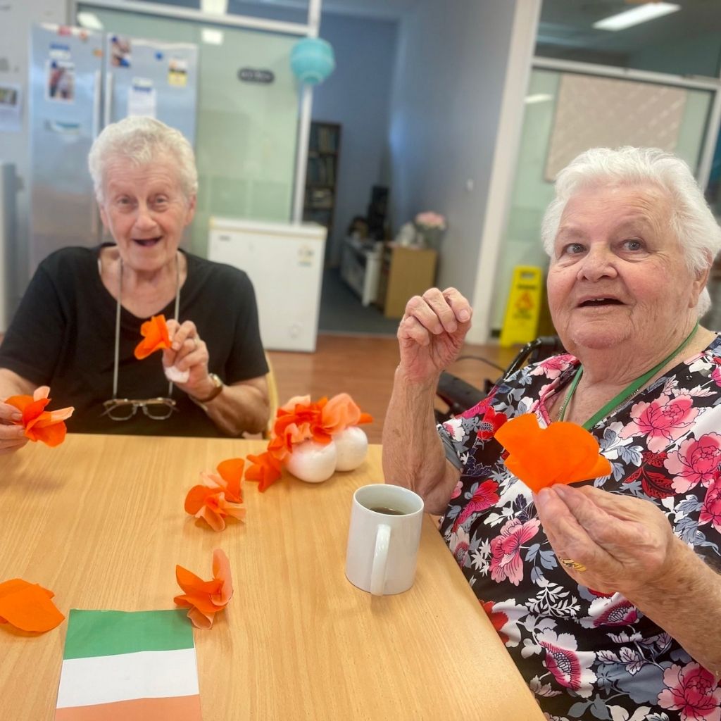 two client making Harmony Day crafts at our Activity Centre